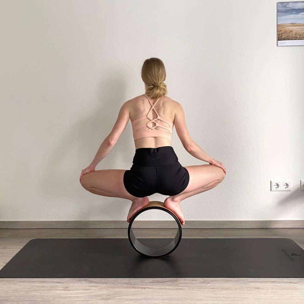 stand on yoga wheel